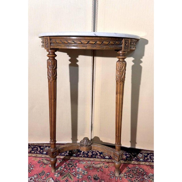 Louis XVI style half-moon console table in carved wood marble top carved decoration tapered legs with fluting and a stretcher