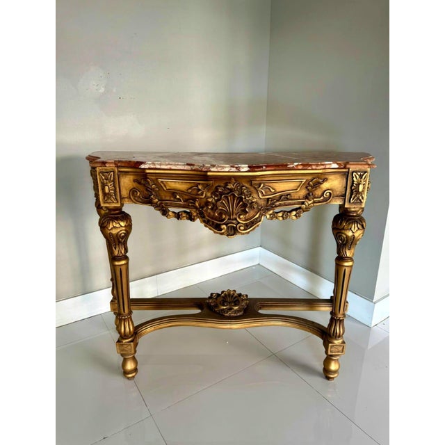 Elevate your interior with this exquisite French-style console table, featuring a multicolor marble top and a fully...