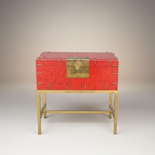 This is a late 20th century Chinese Export style burnt orange or Chinese red lacquer box on stand or side table. It opens...