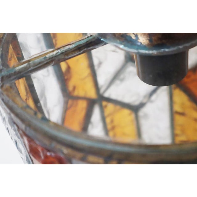 This brutalist pendant lamp made of hammered glass is something truly special. The glass was lovingly crafted by hand, and...