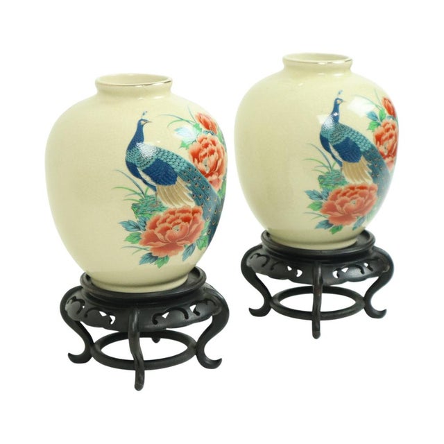 Vintage pair of Japanese vases with multicolored peacock and floral decoration, made of crackle-glazed ceramic, standing...