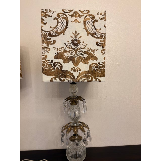 The Hollywood Regency vintage Austrian crystal lamps with vintage hand stamped Fortuny fabric are quite stunning and make...
