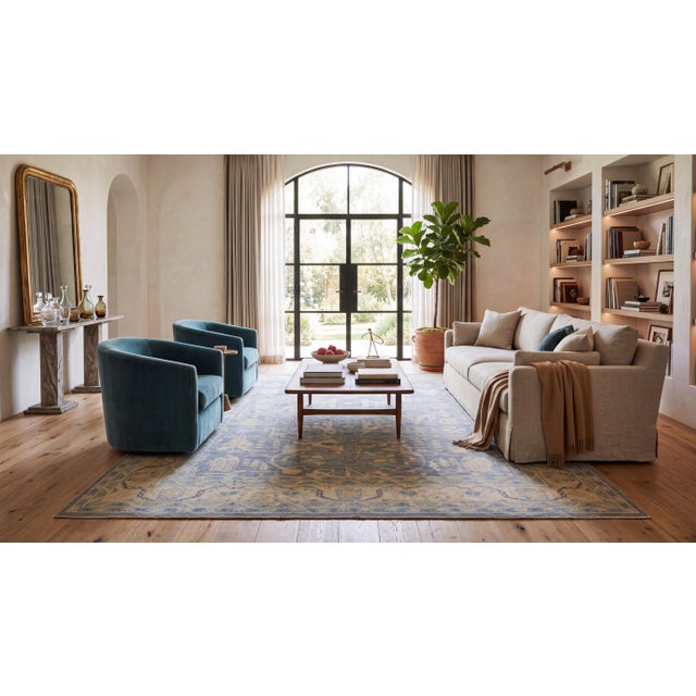 Elevate high-end interior spaces with this contemporary hand-knotted wool area rug, designed in the refined tradition of...