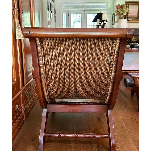 Bring tropical elegance and resort-inspired comfort to your home with this striking vintage plantation-style lounge chair...