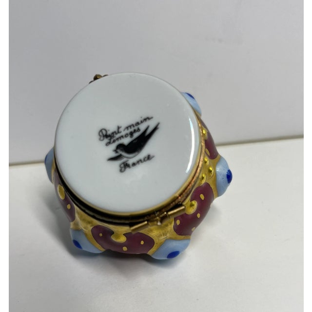 Charming retired design (vintage) royal king's crown with fleur-de-lis in burgundy, white, royal blue and gold accents....