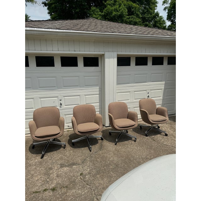 Super comfy bucket office chairs by Faultess Doerner, circa 1970s. Base legs have a unique curved design, and casters roll...