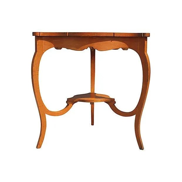 Carved wood table with top glass panel that lifts up for display.