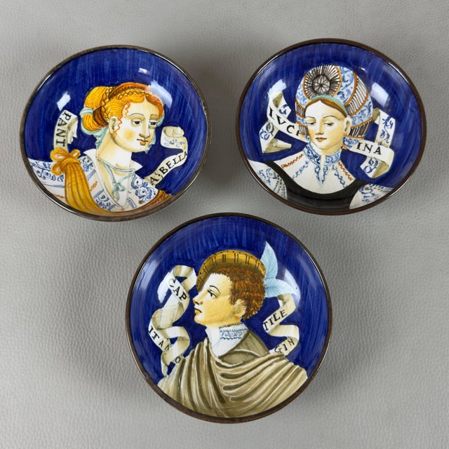 A fine set of three hand-painted, glazed ceramic wall bowls, original from the prestigious e. Mari urbino (maffei)...