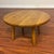 Vintage solid oak round occasional table useable as a side or a coffee table. It features seamless, gently rounded edges...