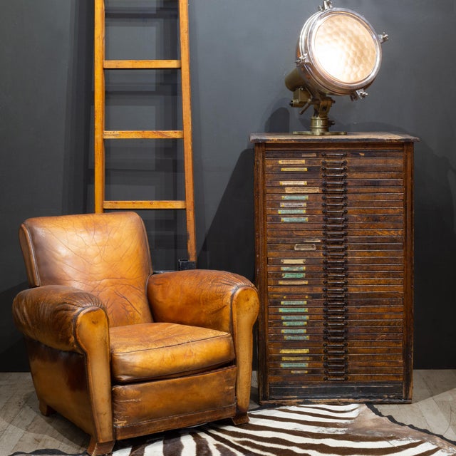 ABOUT An early 20th century printer's wooden typeset cabinet with 36 wooden segmented drawers used to house steel typeset...