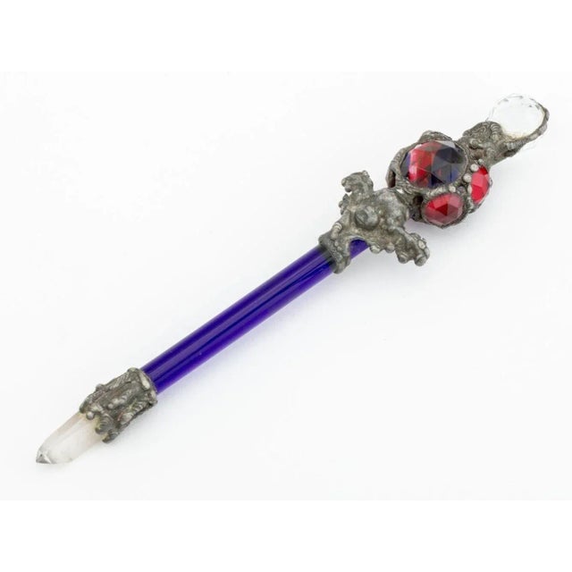 Two Cobalt Blue and Rock Crystal Wands, each with star motif etched stem, forged metal cherub, and polychrome glass and...