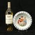 A vintage German porcelain child's bowl featuring a colorful transferware image of three girls playing with a goat,...