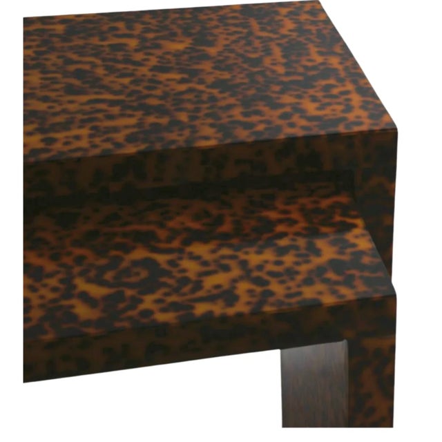 Make a statement with the Raleigh Nesting Tables – featuring a glossy Tortoise Finish, accented with striking brass...
