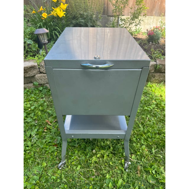 Vintage industrial steel storage cabinet manufactured by Steel-Parts Mfg. Co. of Chicago, Illinois. A substantial mid-...