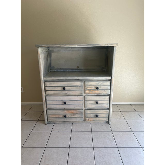 Rustic farmhouse buffet hutch with a beautifully distressed whitewashed finish. Crafted from solid wood with charming...