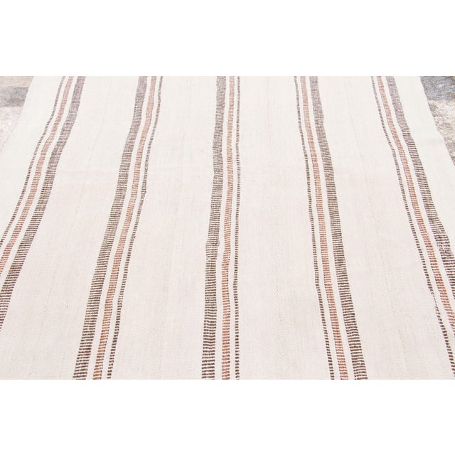 Handwoven from hemp and originating from Turkey circa 1950-1959, this 6x5 vintage kilim joins Rug & Kilim’s Kilim & Flat...