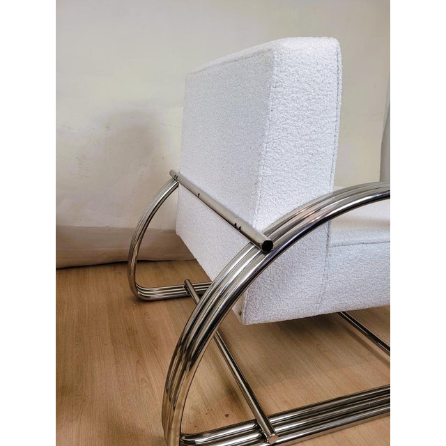 Pair of large chrome armchairs with rounded tubes in Art Deco style, based on the Hudson model by designer Ralph Lauren....