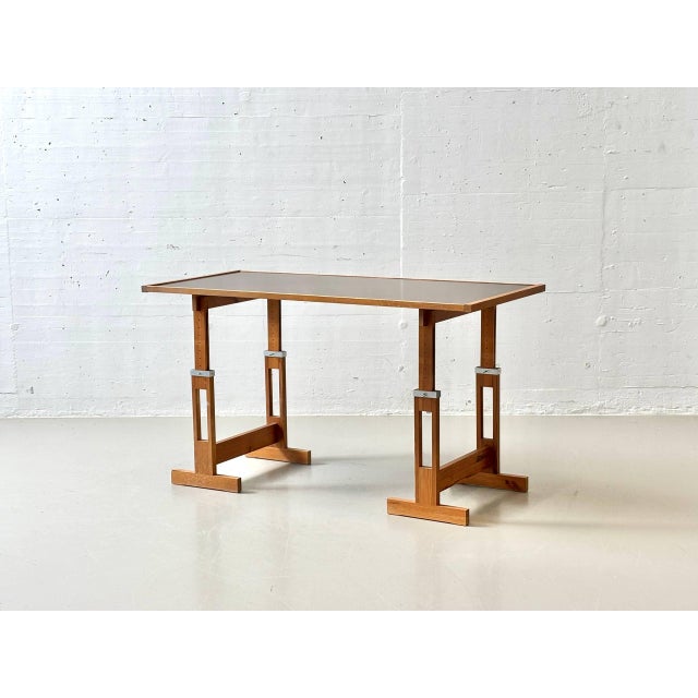 Striking vintage work table with a clean, functional design reminiscent of the 1960s and 70s. The combination of a solid...
