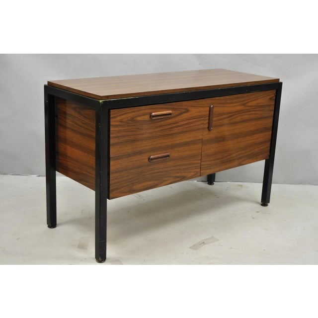 Vintage Mid Century Modern Faux Rosewood Laminate (Not wood) Floating Frame Credenza Cabinet. Item features a laminated...