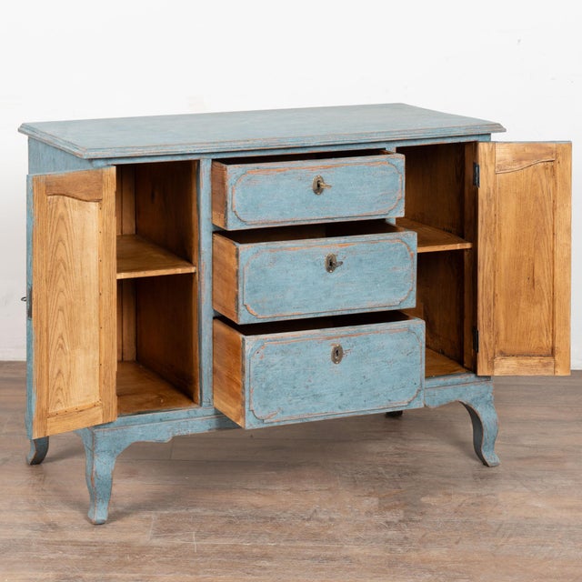 Antique Swedish country baroque style pine cabinet or small sideboard with three central drawers flanked by two narrow...