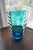 A rarer Blenko, non-crackle, hand-blown vase. This vase has a turquoise tapering body with hand-applied clear glass wings....