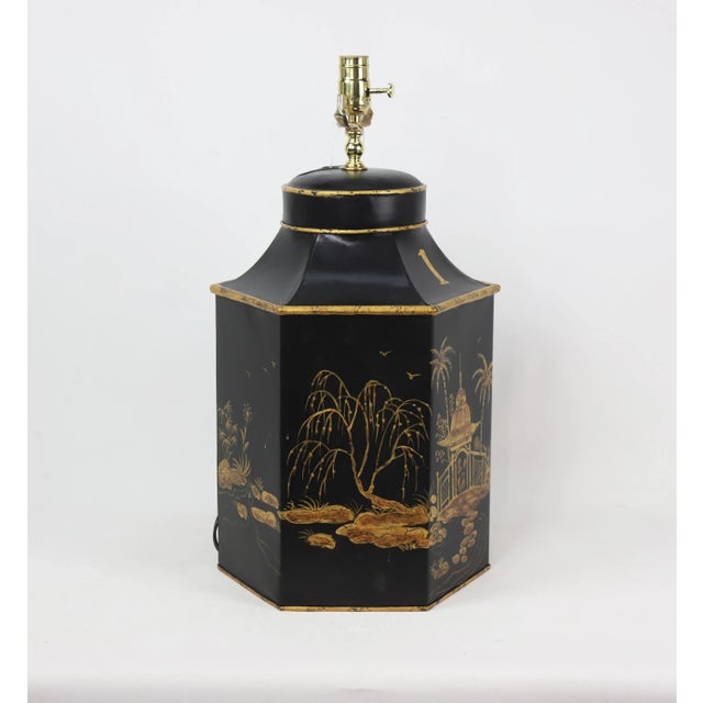 This vintage hexagonal tea caddy has an amber colored pavilion painted onto a black backdrop. This one is labeled No. 1,...