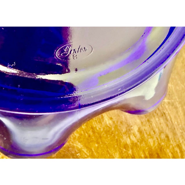 This is a vintage cobalt blue art glass bowl, clearly identifiable as a Fenton piece by the visible “Fenton Handmade”...