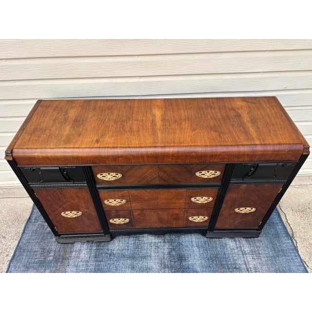 1930s Vintage Art Deco Waterfall Sideboard or Buffet Featuring Burl Wood Veneers, Black-Painted Accents, and Ornate Brass Hardware For Sale - Image 5 of 12