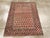 An antique Caucasian Shirvan rug. The rows of botehs reverse direction on the beige field of this east Caucasian prayer...