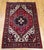 "A rare find in a near square format, this mid-20th century Persian Heriz area rug is a striking example of traditional...