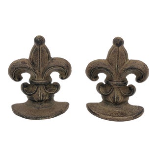 Vintage Cast Iron Verdigris Finish Fleur De Lis Bookends or Doorstops - A Pair For Sale