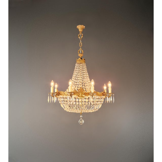 An elegant oval crystal chandelier with balanced proportions and refined detailing. The elongated shape makes it...