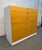 Striking modern twelve-drawer dresser featuring beautifully figured birdseye maple veneer in a warm honey-golden finish....