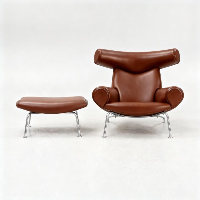Ox Chair with matching ottoman designed by Hans J. Wegner and produced by Erik Jørgensen. This is a very different piece...