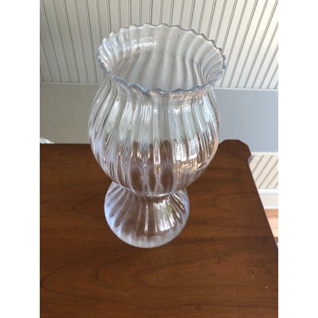 Vintage large, clear blown glass vase. Features an unusual fluted design and ribbed surface. Small, clear sticker on the...
