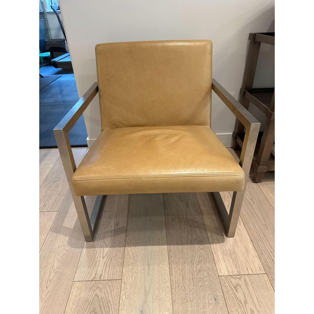 Stainless steel and a soft tobacco colored leather. Currently in a professional office. Featuring an angular floating...