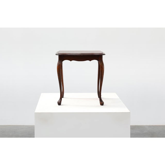 A charming English side table in the Queen Anne taste, dating to around 1900. Elegant in both form and proportion, the...