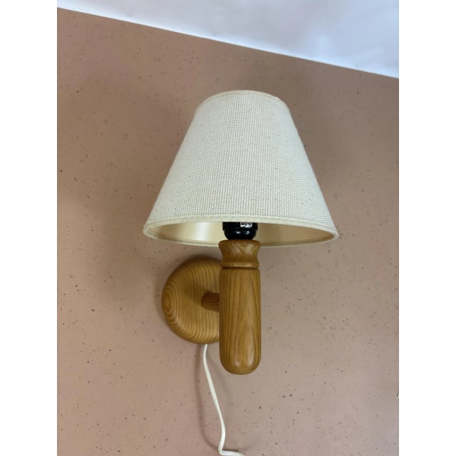 Lyfa Wall Lamp, Denmark, 1970s Nice wall lamp by Lyfa from the 1970s made in Denmark. The lamp has a pine wood frame with...
