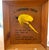 The most striking feature of this decor piece is the large vibrant, yellow fishing fly. It’s exaggerated size and vivid...