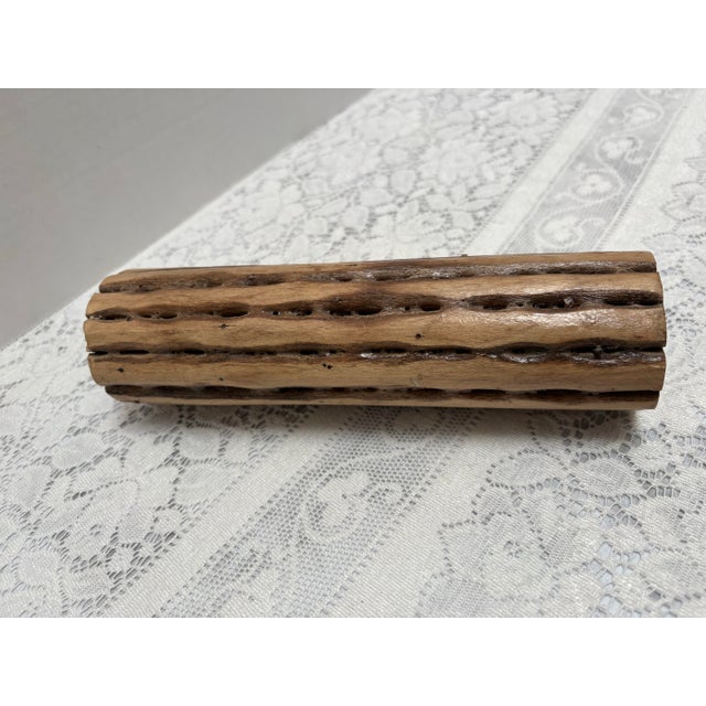 Petite Brazilian rain stick. Rustic carved tribal rattle filled with tiny beads or seeds. As you turn it from side to side...
