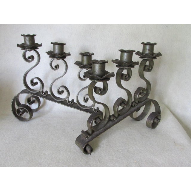 A pair of Vintage hand wrought iron candelabras, candlesticks. The Candelabras could be used in an Arts & Crafts, Mission...