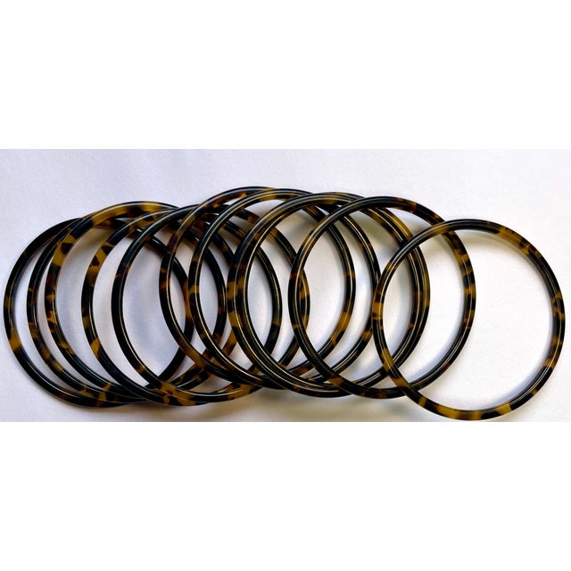 This is a classic set of bangles made of acrylic resin in a handsome faux tortoise pattern. 2 ⅝ x 2 ⅝ x ⅛ each...