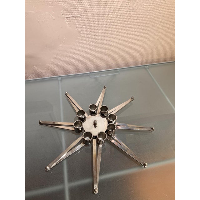 Chrome-plated steel candlestick, 1970s Star-shaped and modular design Origin: (Habitat - France?) Dimensions: Diameter 36...