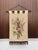 A finely crafted wall hanging from the 1950s, hand-embroidered with silk and wool thread on a warm-toned linen blend. The...
