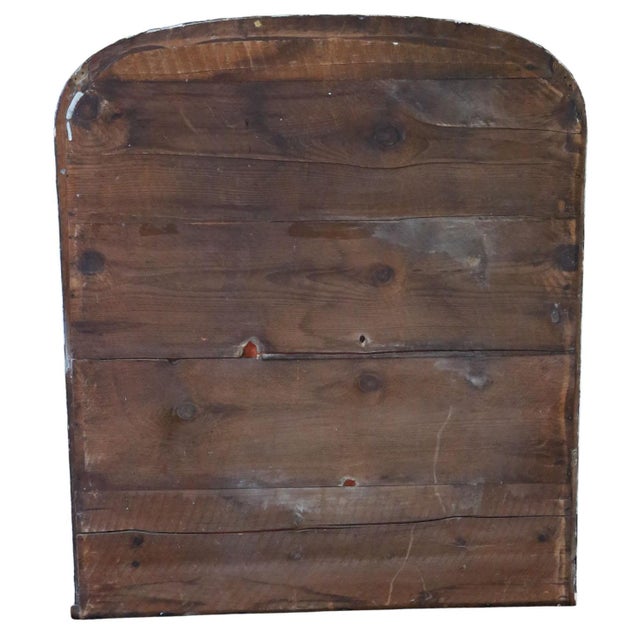 This is a 19th-century antique black and cream overmantel mirror. Its classical design allows it to be used above a...