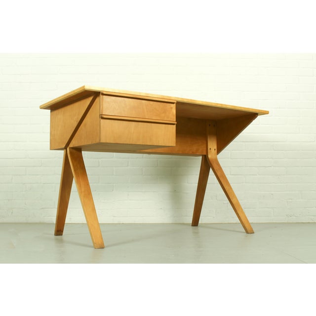 Bring a piece of Dutch design history into your workspace with this iconic model EB02 writing desk designed in 1952 by...