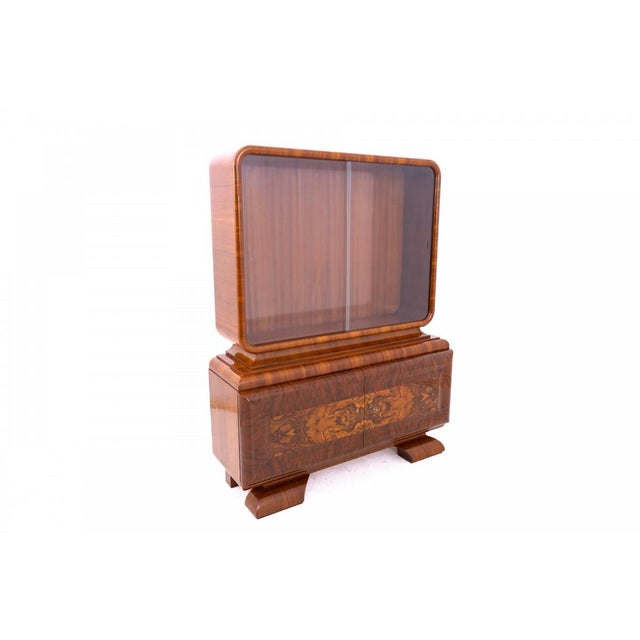 Art Deco display cabinet from circa 1920, Germany. This piece of furniture is in very good condition, professionally...
