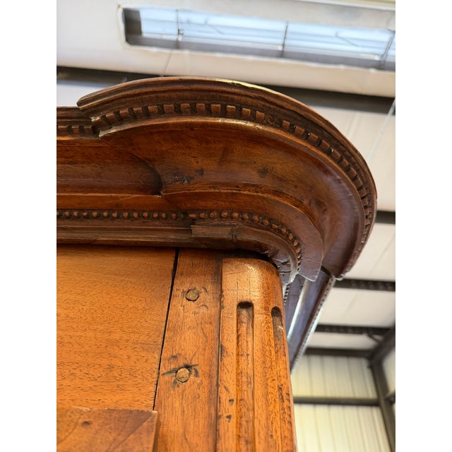 18th century French provincial walnut armoire. Beautiful patina and lovely carving of sunflowers. Detailed carving on the...