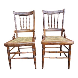 Pair of Victorian Walnut Carved and Spindle Cane Seat Side Chairs For Sale