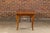 A rustic French Louis XV style fruitwood farm dining table from the 19th century with bread board, cabriole legs, carved...